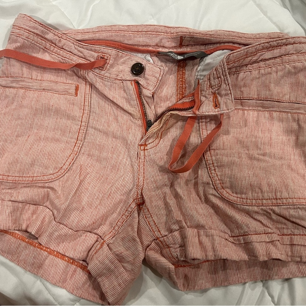 Orange women’s north face shorts size 6